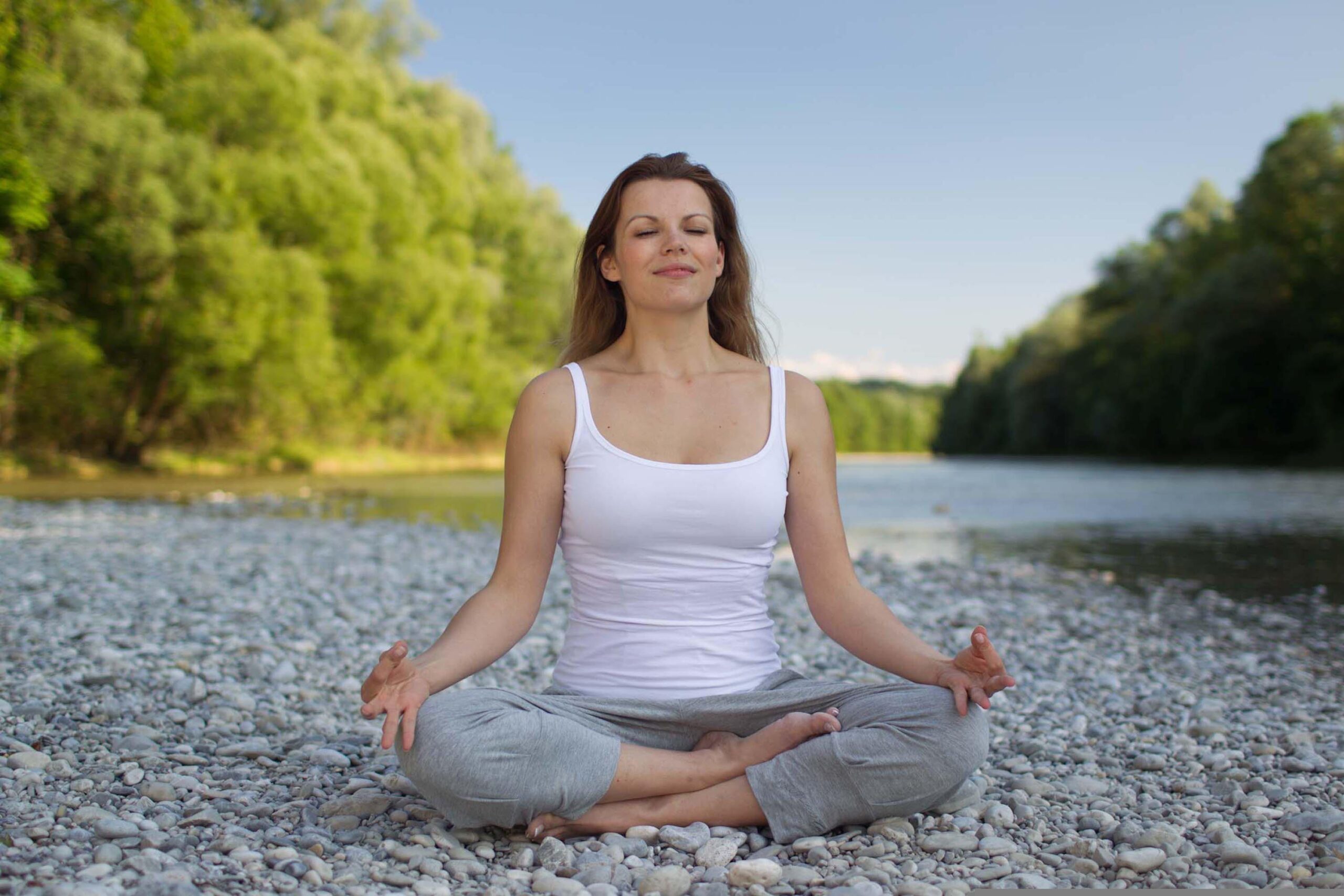 Woman with improved mental health doing yoga.